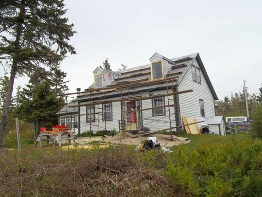 View of scaffolding used to access second floor during the renovation Heritage Cape Cod home