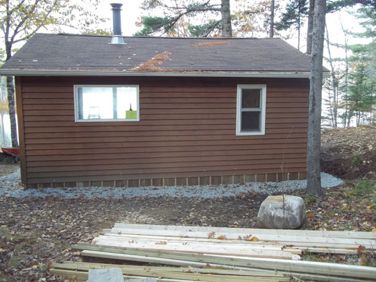 Renovate lakeside cottage with new interior, and deck