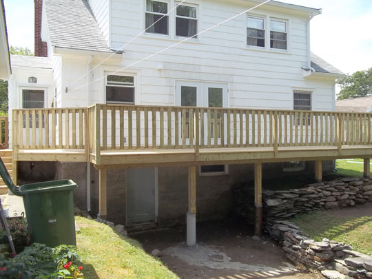 New deck wraps around full width of house adding plenty of outdoor space.