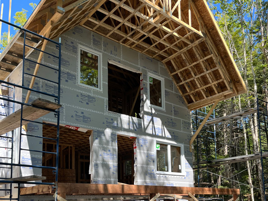 Two story home with large roof overhang