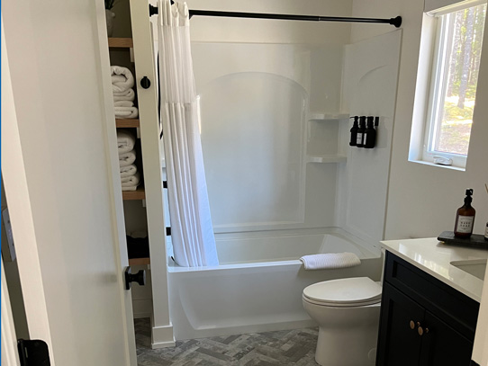 Cheerful and bright washroom with linen closet
