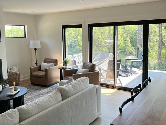 One sliding door and two windows in large living room for great lake views
