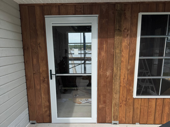 Door of new entrance way, with view of the lake