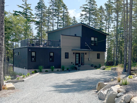 Large single storey new home with attached garage, and front covered porch.
